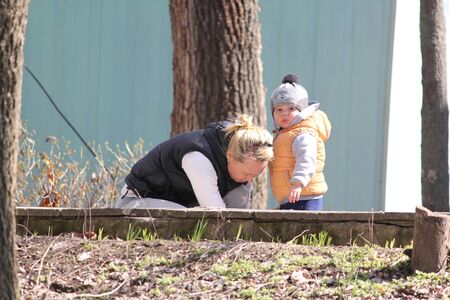Mother and child on the playground in the open air in springの写真素材