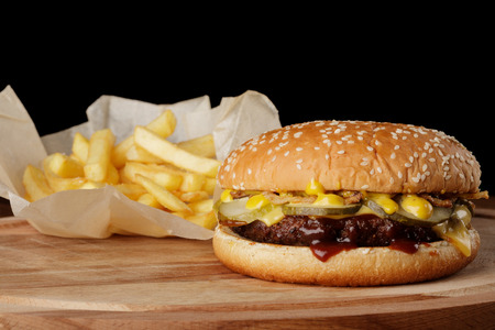 Burger (hamburger) with french fries and sauce.の写真素材