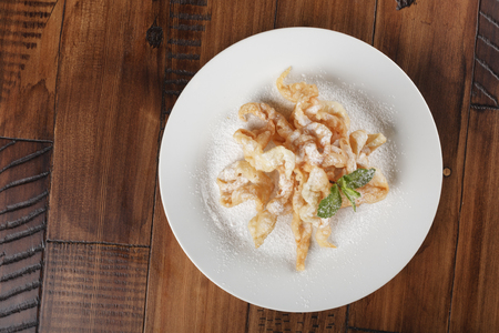 "Angel wings" polish pastry. Cookie on a white plate.の写真素材