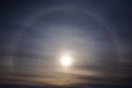 Sun halo (Corona) on a cloudy sky. Abstract background.の写真素材