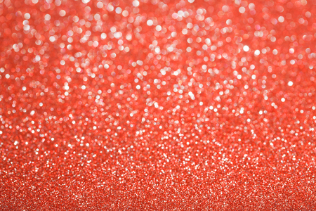 Red (ruby) glitter background. Sparkle texture. Abstract background blurred for New Years or Christmas holidayの写真素材