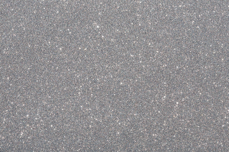 Silver (gray) glitter background. Sparkle texture. Abstract background for New Years or Christmas holidayの写真素材