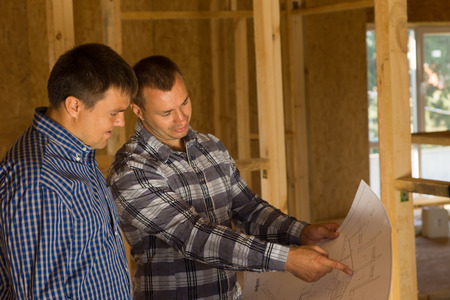 White Professional Male Building Architect and Client Discussing the Interior Building Design on the...