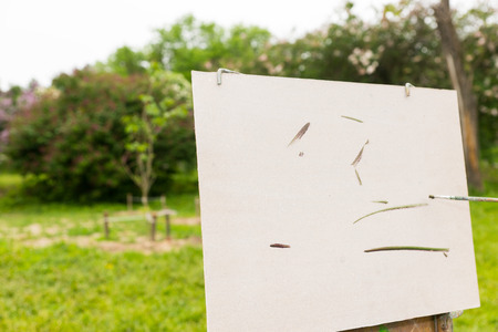 Begining of creation a painter's sketch on sketchbook in a parkの写真素材