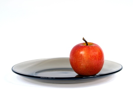 apple resting upon plate     の写真素材