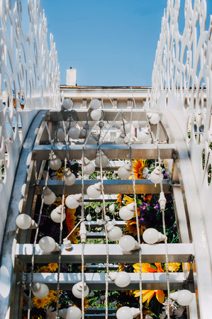 Electric light bulbs on a metal frame on a street decorationの写真素材