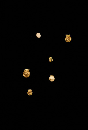 Lamps hang on the ceiling on a black backgroundの写真素材