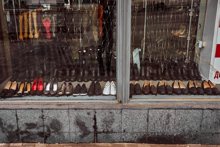 Shoes behind the glass on the old counterの写真素材