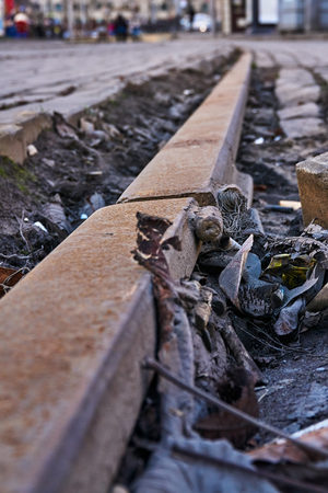 Old rusty rails in the garbage in the cityの写真素材