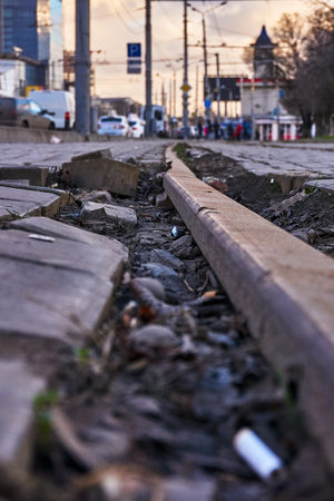 Old rusty rails in the garbage in the cityの写真素材