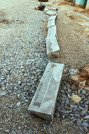 A new gray curb on the road liesの写真素材