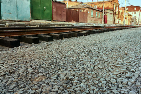 New rails and wooden sleepers are prepared for laying on gravelの写真素材