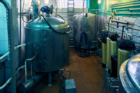 Private small brewery metal tanks and pipesの写真素材
