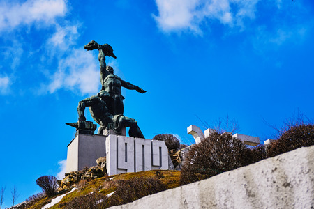 The monument of the strike of 1902, two men on a concrete pedestal in Rostov-on-Don on a hillの写真素材