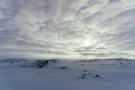 The hills and slopes are covered with a thick layer of snow and barkhans in the winter in the northの写真素材