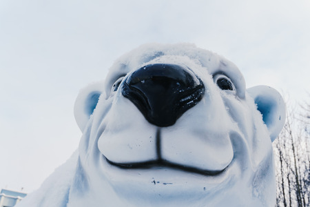 Murmansk , Murmansk region / Russia - February 2018: Large plastic polar bear smiles with a small bear in the center of Murmanskのeditorial素材