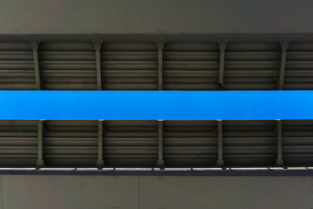 Smooth edge of a new metal bridge against a blue clear skyの写真素材