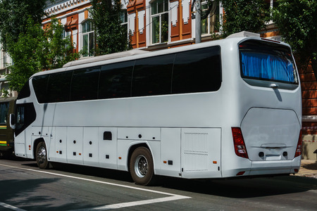 A large passenger bus plying along route number 7 in the center of a large cityのeditorial素材