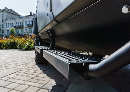 The new armored military car is green on the street on a sunny dayのeditorial素材