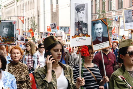 Rostov-on-Don / Russia - 9 May 2018: People in the procession of the Immortal Regiment carry...