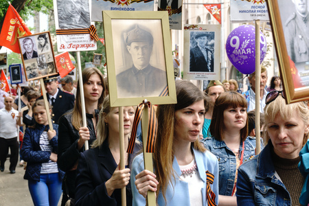 Rostov-on-Don / Russia - 9 May 2018: People in the procession of the Immortal Regiment carry portraits of the participants of World War II who are no longer alive as a sign of memory and sorrowのeditorial素材