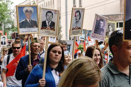 Rostov-on-Don / Russia - 9 May 2018: People in the procession of the Immortal Regiment carry...