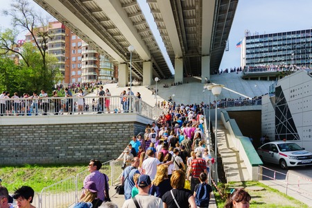 Rostov-on-Don / Russia - May 2018: A crowd of people on the embankment of the Don River near the bridge and from observation platforms came to look at the parade of naval forcesのeditorial素材