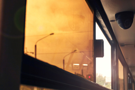 passengers in the bus opened a tinted window in the cabin of the bus that would cool the outside air...