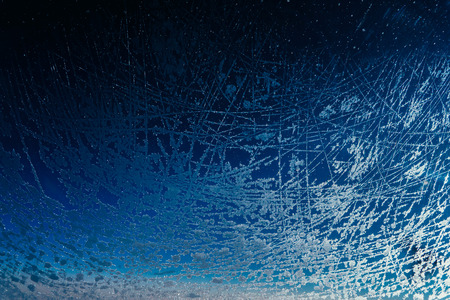 the porthole of a large passenger plane froze and was covered with a layer of ice with beautiful...