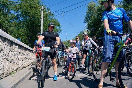 Rostov-on-Don / Russia - may 2018: a lot of people with children riding their bicycles through the...