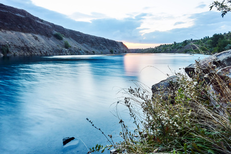 The purest blue lake amid unspoiled nature at dawn on a nice summer day