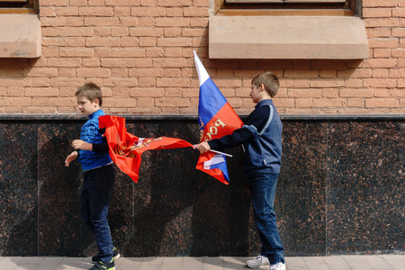 Rostov-on-Don / Russia - 9 May 2018: People with flags and in military uniform celebrate the great holiday May 9 Victory Day along the central streets of the city walking along the closed roadsのeditorial素材