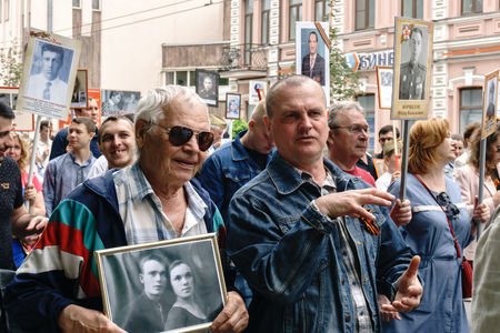 Rostov-on-Don / Russia - 9 May 2018: People in the procession of the Immortal Regiment carry...
