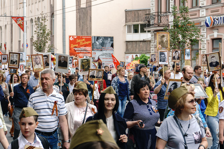Rostov-on-Don / Russia - 9 May 2018: People in the procession of the Immortal Regiment carry...