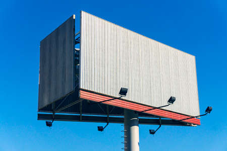 empty Billboard with three sides on a high postの写真素材