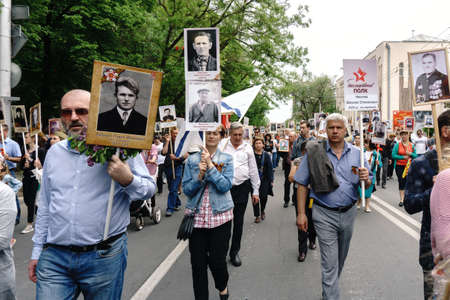 Rostov-on-Don / Russia - 9 May 2018: People in the procession of the Immortal Regiment carry...
