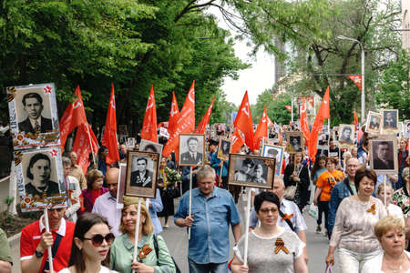 Rostov-on-Don / Russia - 9 May 2018: People in the procession of the Immortal Regiment carry portraits of the participants of World War II who are no longer alive as a sign of memory and sorrowのeditorial素材