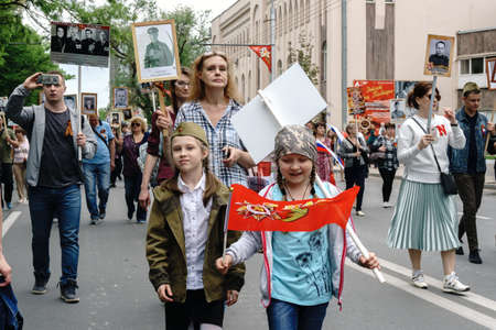 Rostov-on-Don / Russia - 9 May 2018: People in the procession of the Immortal Regiment carry portraits of the participants of World War II who are no longer alive as a sign of memory and sorrowのeditorial素材