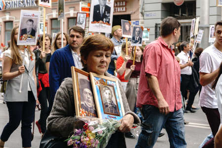 Rostov-on-Don / Russia - 9 May 2018: People in the procession of the Immortal Regiment carry...