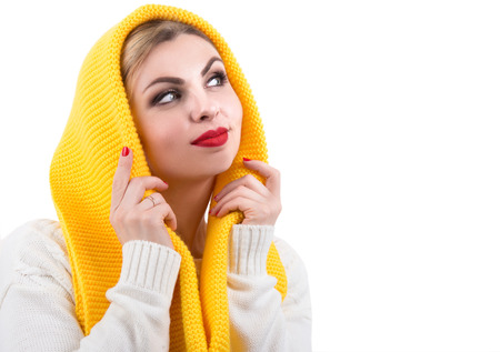Girl in a bright knitted scarfの写真素材