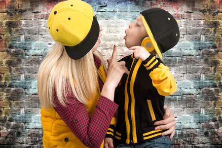 A young mother and little son.in the style of hip hop.Fashionable family.The Young Rapper.Cool dj.の写真素材