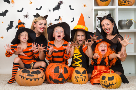 Children with moms celebrating Halloween.の写真素材