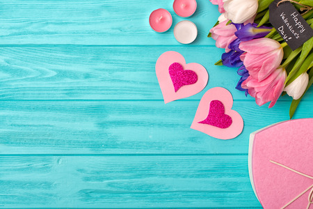 Valentines Day background with bouquet of tulips, a valentine's card and a gift.の写真素材