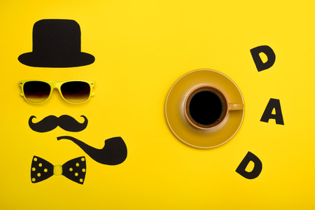 Happy Father's Day. Postcard and a cup of hot coffee for dad.の写真素材