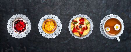 A cup of tea and fresh delicious pastries. Sweet pastries.