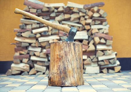 Preparation of firewood for the winter. Firewood background. Background of dry chopped firewood....