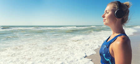 Morning exercises on the coast.Woman doing exercises on the beach, meet the sunrise.Fitness, sport,...