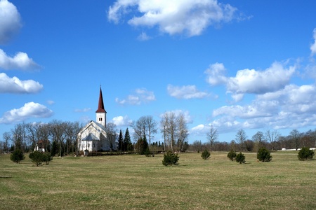 Estonia  Beautiful operating church on a background of the sky and cloudsの写真素材