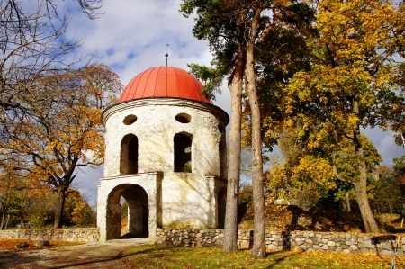 Old tower of manor on a background of autumn treesの写真素材