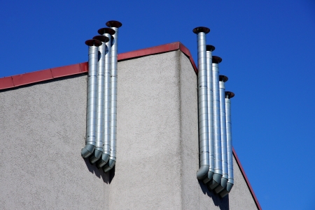 Metal pipes are located in one lineの写真素材